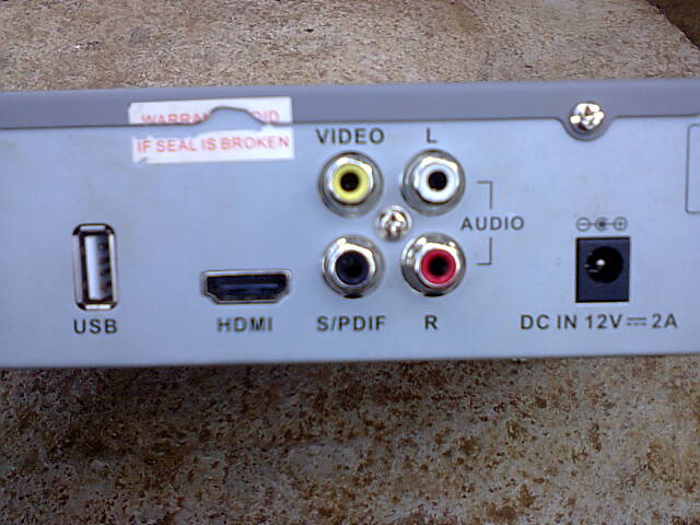 the backside of a zuku decoder showing adapter connector rating of 12Volts 2Amperes