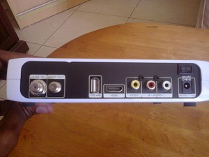 The backside of an Azam decoder showing the HDMI RCA USB and LNB ports